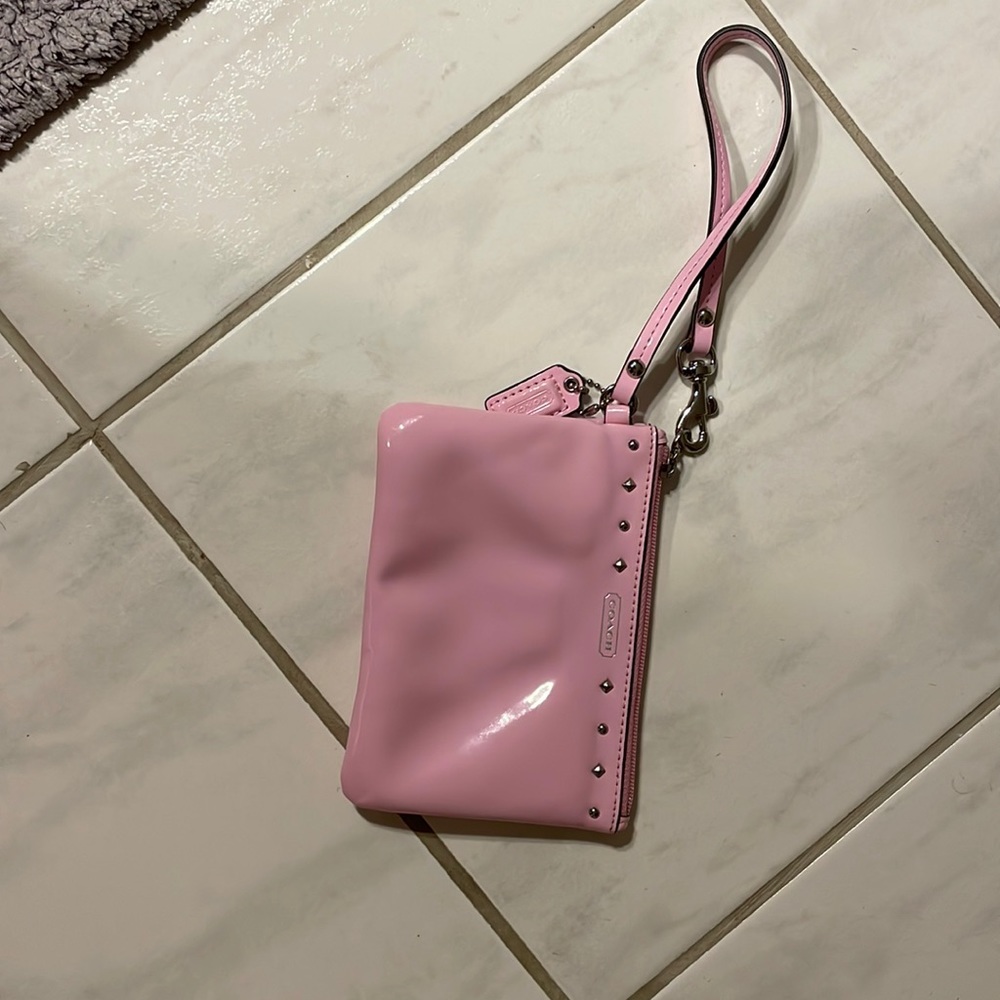 Like new pink patent coach wristlet - super cute, great quality bag.